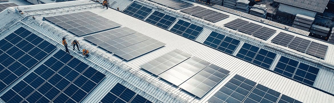 Businesses investing in solar panels for renewable energy and implementing ESG practices.